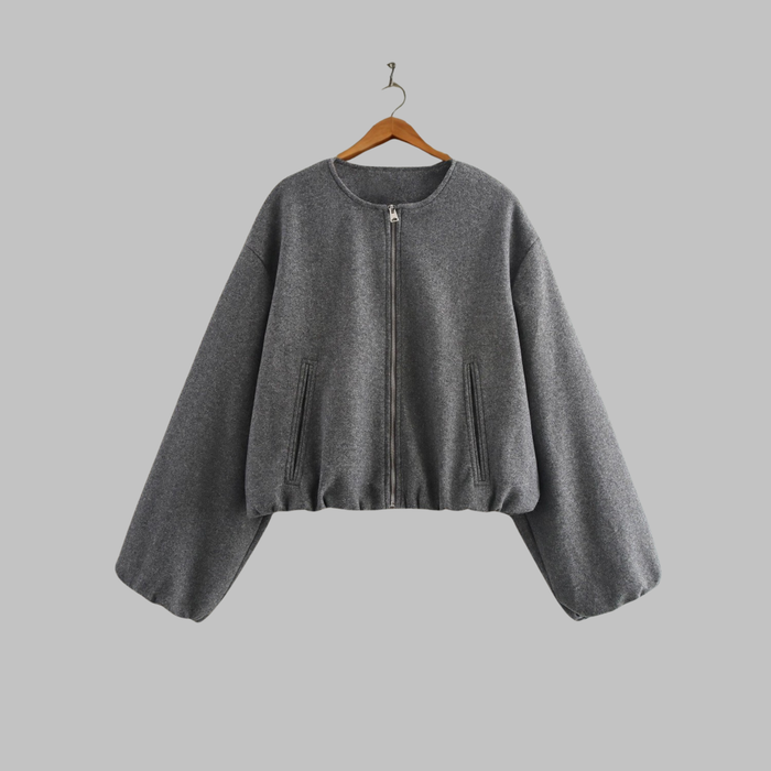 Cropped zip jacket with collarless neckline in soft structured design, perfect for a stylish and modern look. 0