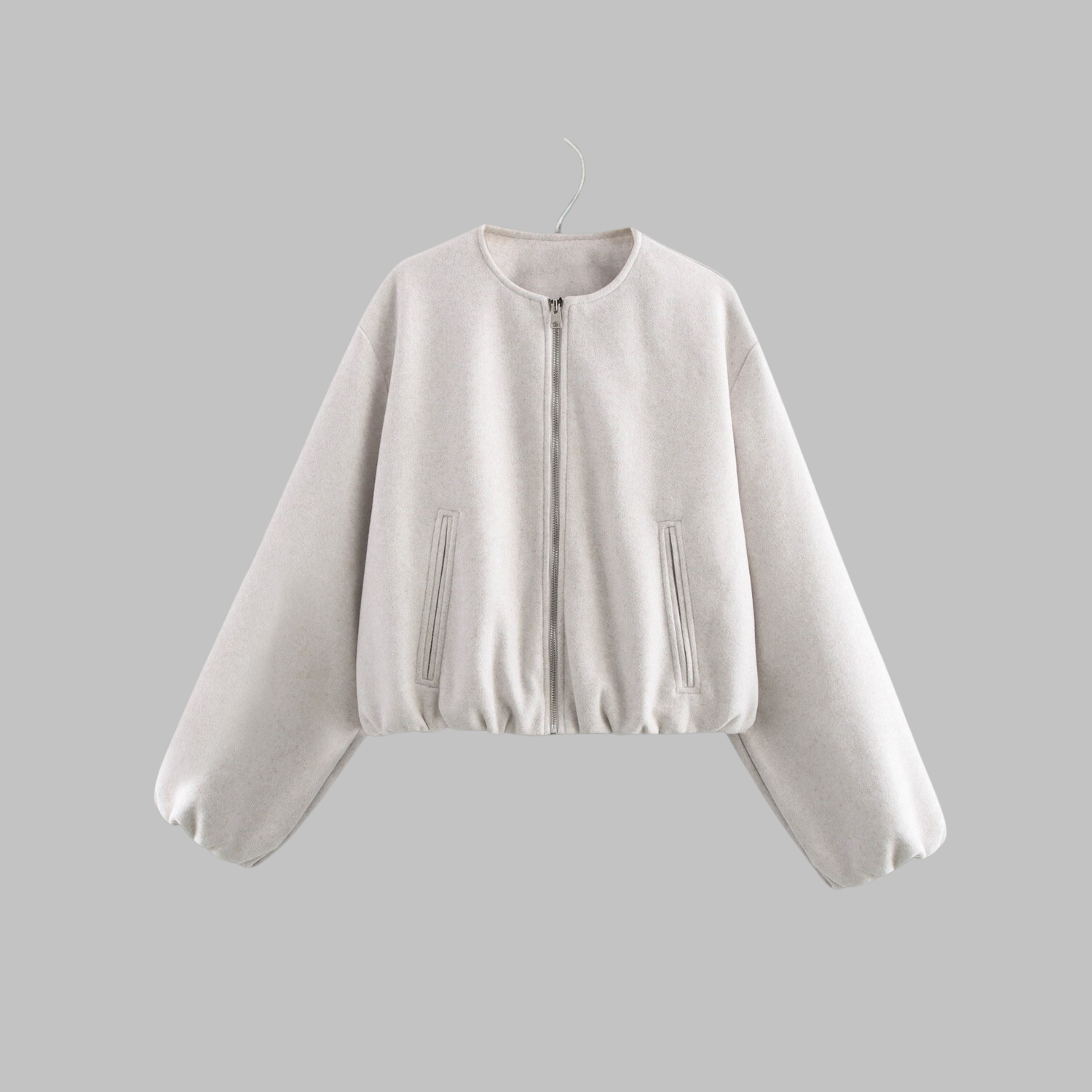 Cropped zip jacket with collarless neckline in soft structured design, perfect for a stylish and modern look. 1