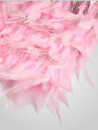 Elegant feathered mini dress featuring a chic silhouette, perfect for stylish parties and special occasions. 8
