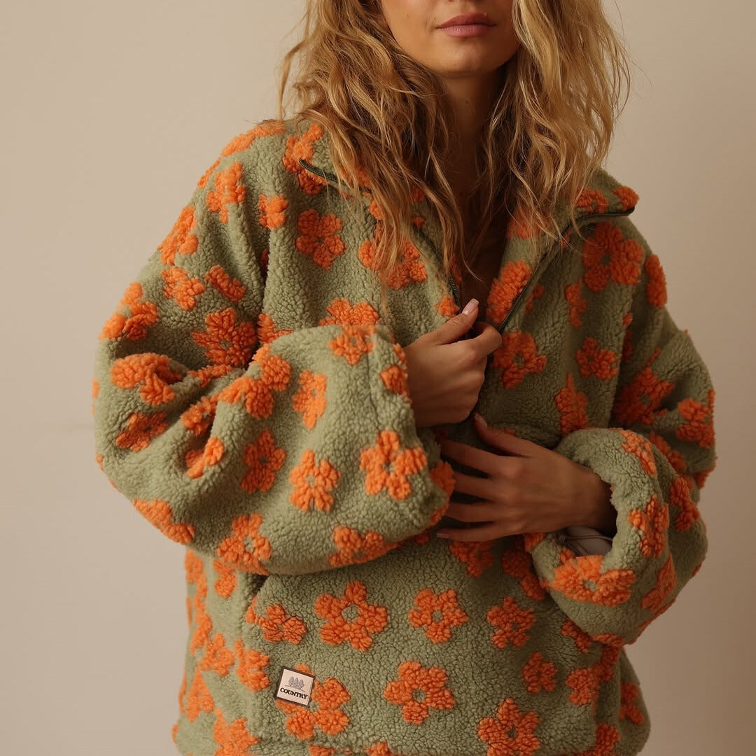 Fleece sweater for women featuring a relaxed fit, made from ultra-soft sherpa fabric with a stylish floral pattern. 4