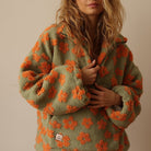 Fleece sweater for women featuring a relaxed fit, made from ultra-soft sherpa fabric with a stylish floral pattern. 4