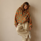 Fleece sweater for women featuring a relaxed fit, made from ultra-soft sherpa fabric with a stylish floral pattern. 6