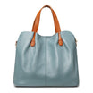Genuine leather handbag with adjustable strap, featuring luxurious lychee grain cowhide, available in blue, black, pink, gray, and beige, designed 1