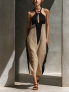 Halter neck midi dress featuring a keyhole cutout in a black and beige cotton blend, designed for an elegant fitted silhouette. 0