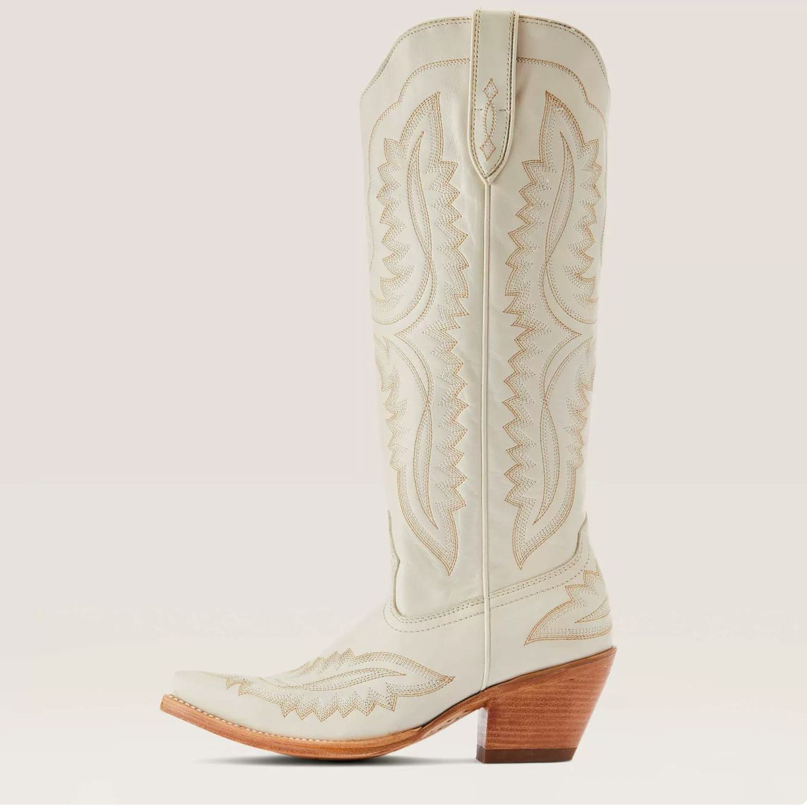 Ivory Western boot featuring a sculpted heart design and stylish metal accents, perfect for adding a touch of country charm to any outfit. 0