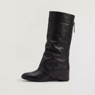 Knee high black boots for women featuring a stylish fold-over cuff and a comfortable low wedge heel, made with vegan upper materials. 0