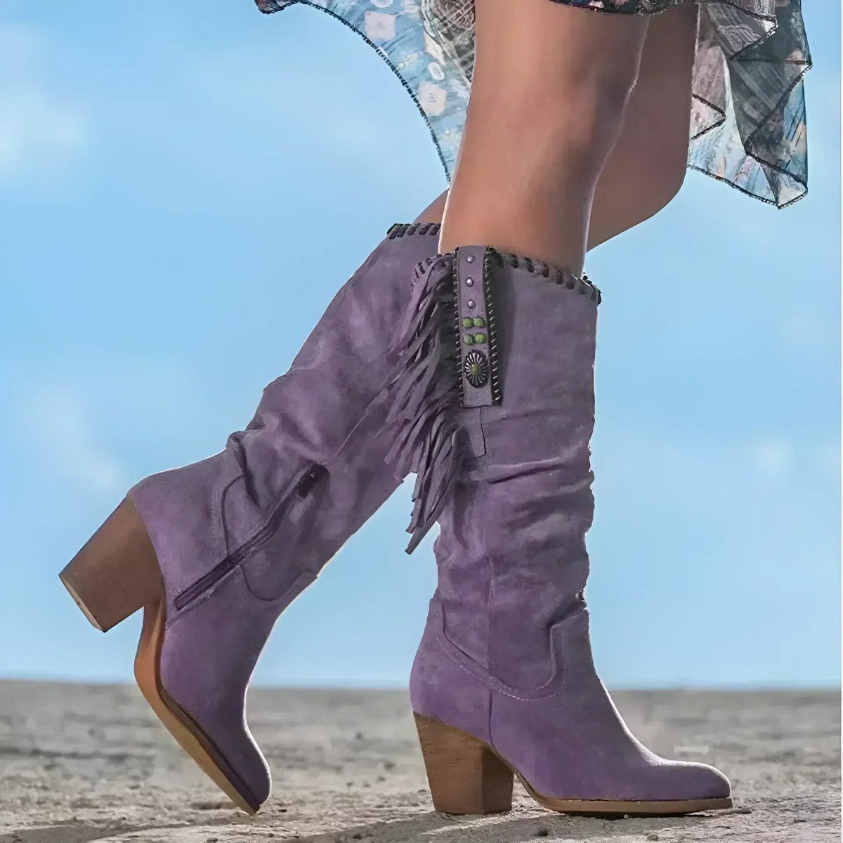 Knee high tan suede boots for women featuring fringe detail and turquoise concho, designed with a stylish block heel. 1