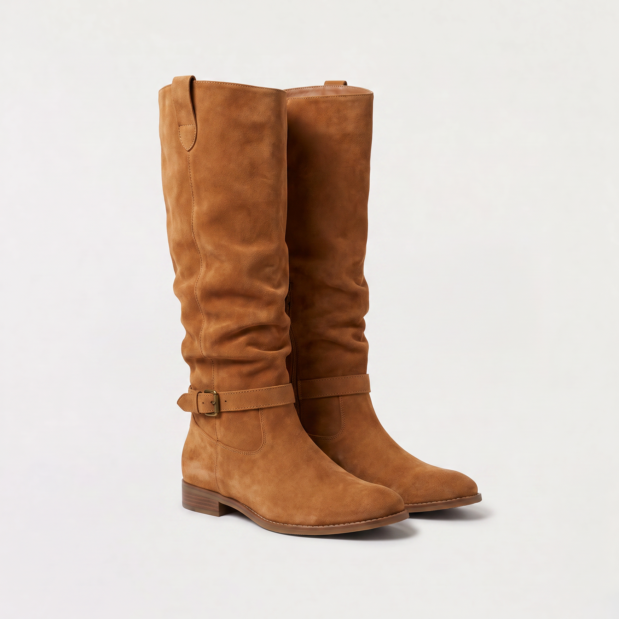 Knee high black boots for women featuring a slouch silhouette and buckled ankle tab, crafted from vegan materials with a low stacked heel. 3