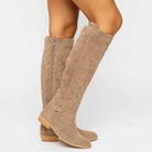 Elegant black knee high suede boots featuring a stylish block heel and convenient side zip, perfect for women's fashion and versatile outfits. 0