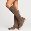Elegant black knee high suede boots featuring a stylish block heel and convenient side zip, perfect for women's fashion and versatile outfits. 1
