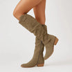 Elegant black knee high suede boots featuring a stylish block heel and convenient side zip, perfect for women's fashion and versatile outfits. 2