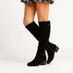 Elegant black knee high suede boots featuring a stylish block heel and convenient side zip, perfect for women's fashion and versatile outfits. 3