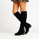 Elegant black knee high suede boots featuring a stylish block heel and convenient side zip, perfect for women's fashion and versatile outfits. 3