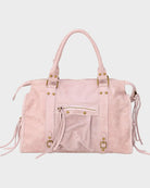 Leather tote bag in vanilla pink featuring adjustable drawstring and zip closure, accented with gold-tone hardware. 0