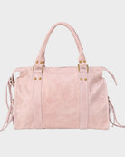Leather tote bag in vanilla pink featuring adjustable drawstring and zip closure, accented with gold-tone hardware. 1