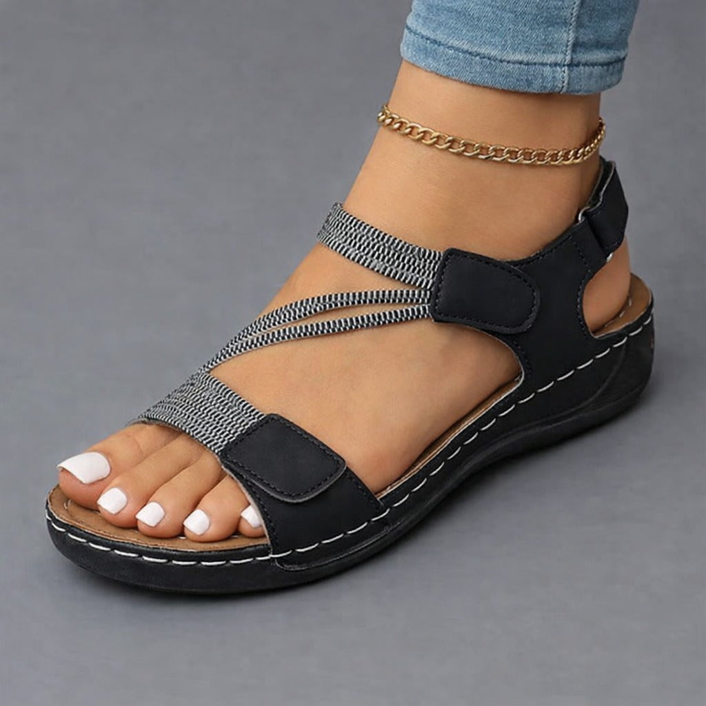 Lightweight orthopedic sandals for women featuring a cushioned footbed and adjustable straps, designed with a modern strappy look for comfort and style. 2