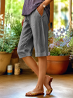 Linen capri pants featuring a V-notch waistband and convenient side pockets, designed for a relaxed fit perfect for warm days. 6