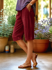 Linen capri pants featuring a V-notch waistband and convenient side pockets, designed for a relaxed fit perfect for warm days. 9
