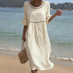 Linen midi dress featuring hollow out detail and flared sleeves, perfect for a relaxed summer look in warm weather. 0