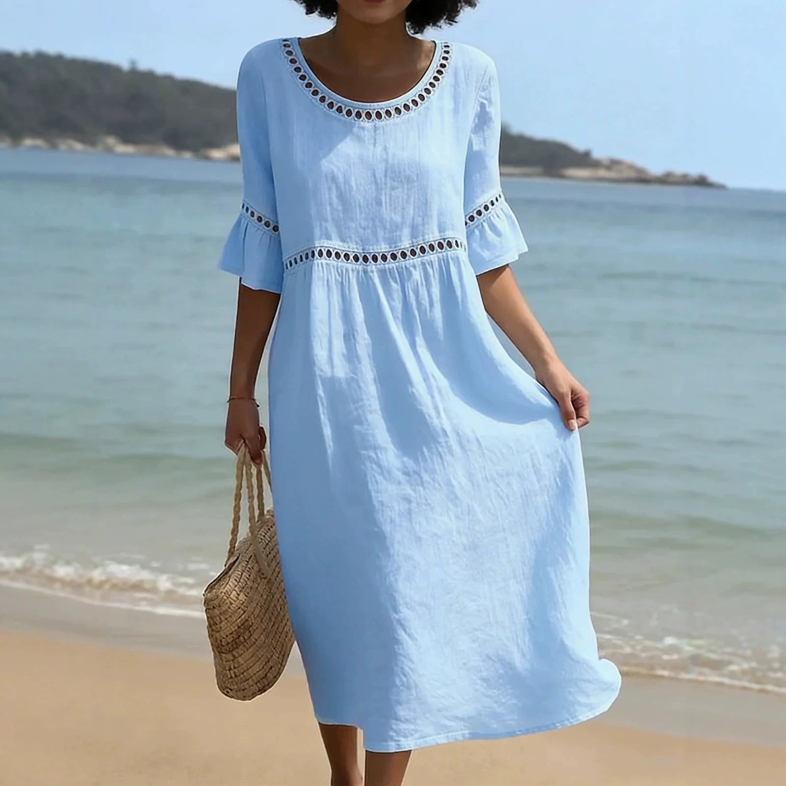 Linen midi dress featuring hollow out detail and flared sleeves, perfect for a relaxed summer look in warm weather. 1