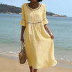 Linen midi dress featuring hollow out detail and flared sleeves, perfect for a relaxed summer look in warm weather. 2