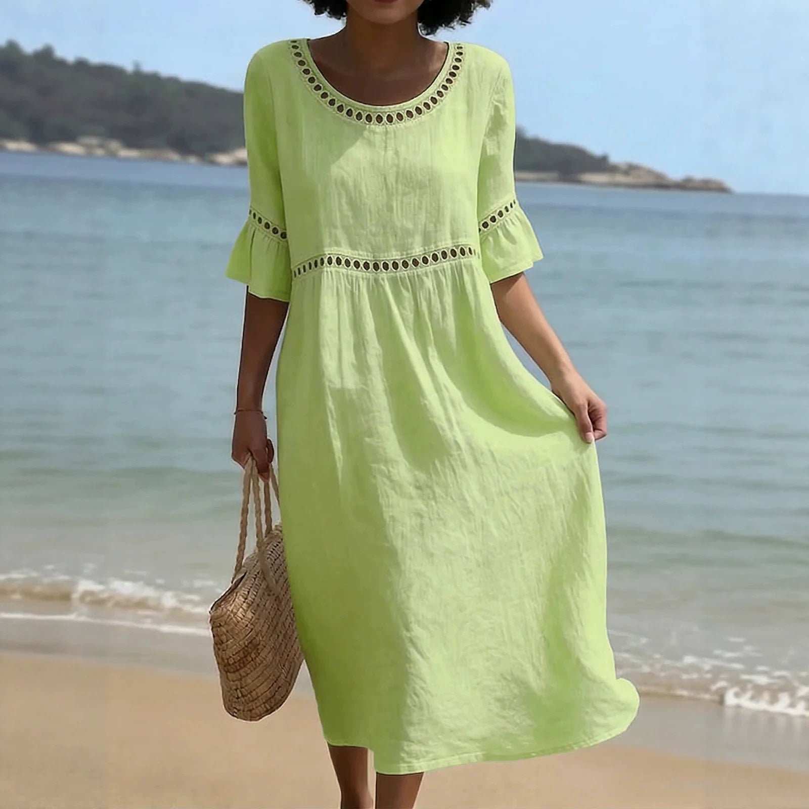 Linen midi dress featuring hollow out detail and flared sleeves, perfect for a relaxed summer look in warm weather. 3