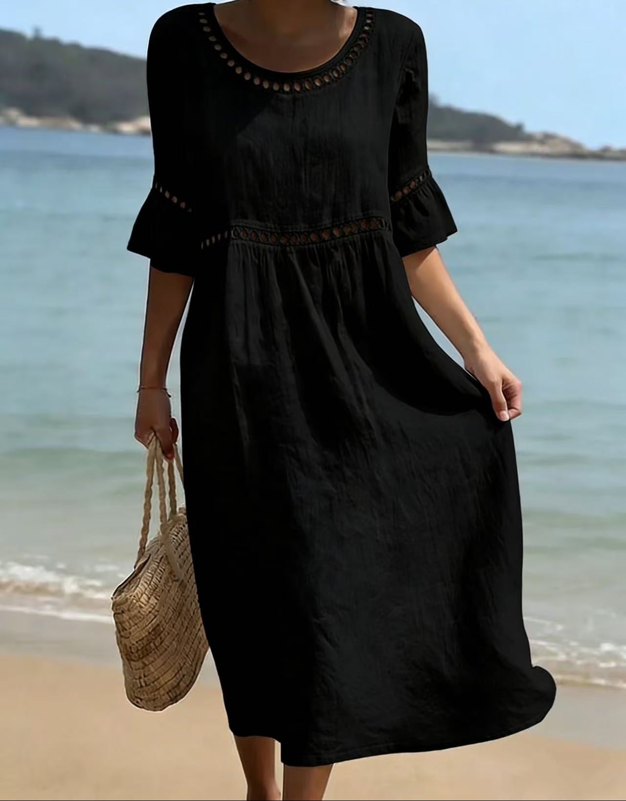 Linen midi dress featuring hollow out detail and flared sleeves, perfect for a relaxed summer look in warm weather. 4