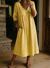 Linen midi dress featuring a V-neck and delicate lace trim, designed in a relaxed A-line silhouette, perfect for summer wear for women. 1