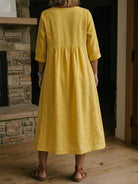 Linen midi dress featuring a V-neck and delicate lace trim, designed in a relaxed A-line silhouette, perfect for summer wear for women. 2