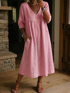 Linen midi dress featuring a V-neck and delicate lace trim, designed in a relaxed A-line silhouette, perfect for summer wear for women. 4