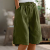 Linen shorts with elastic waist and deep side pockets, featuring a breathable relaxed fit perfect for both men and women. 0