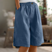 Linen shorts with elastic waist and deep side pockets, featuring a breathable relaxed fit perfect for both men and women. 3