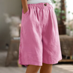 Linen shorts with elastic waist and deep side pockets, featuring a breathable relaxed fit perfect for both men and women. 4