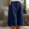 Linen shorts with elastic waist and deep side pockets, featuring a breathable relaxed fit perfect for both men and women. 5