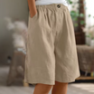Linen shorts with elastic waist and deep side pockets, featuring a breathable relaxed fit perfect for both men and women. 7