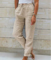 Linen trousers with drawstring waist and straight leg, featuring a relaxed fit and cropped design, perfect for women's summer fashion in white. 1