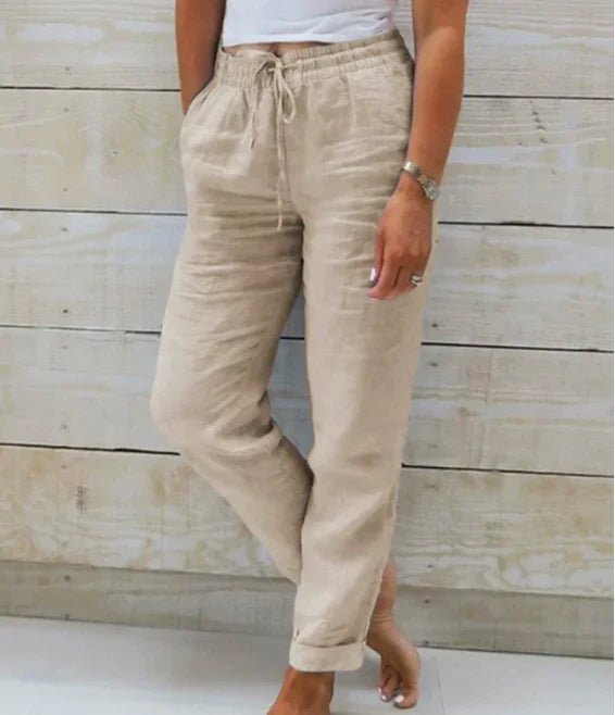 Linen trousers with drawstring waist and straight leg, featuring a relaxed fit and cropped design, perfect for women's summer fashion in white. 1