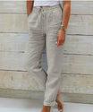 Linen trousers with drawstring waist and straight leg, featuring a relaxed fit and cropped design, perfect for women's summer fashion in white. 2