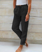 Linen trousers with drawstring waist and straight leg, featuring a relaxed fit and cropped design, perfect for women's summer fashion in white. 3