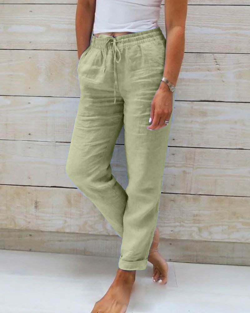 Linen trousers with drawstring waist and straight leg, featuring a relaxed fit and cropped design, perfect for women's summer fashion in white. 4