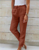 Linen trousers with drawstring waist and straight leg, featuring a relaxed fit and cropped design, perfect for women's summer fashion in white. 6