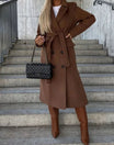 Long wool coat for women featuring a double-breasted design in classic black, tailored fit for a stylish and sophisticated look. 1