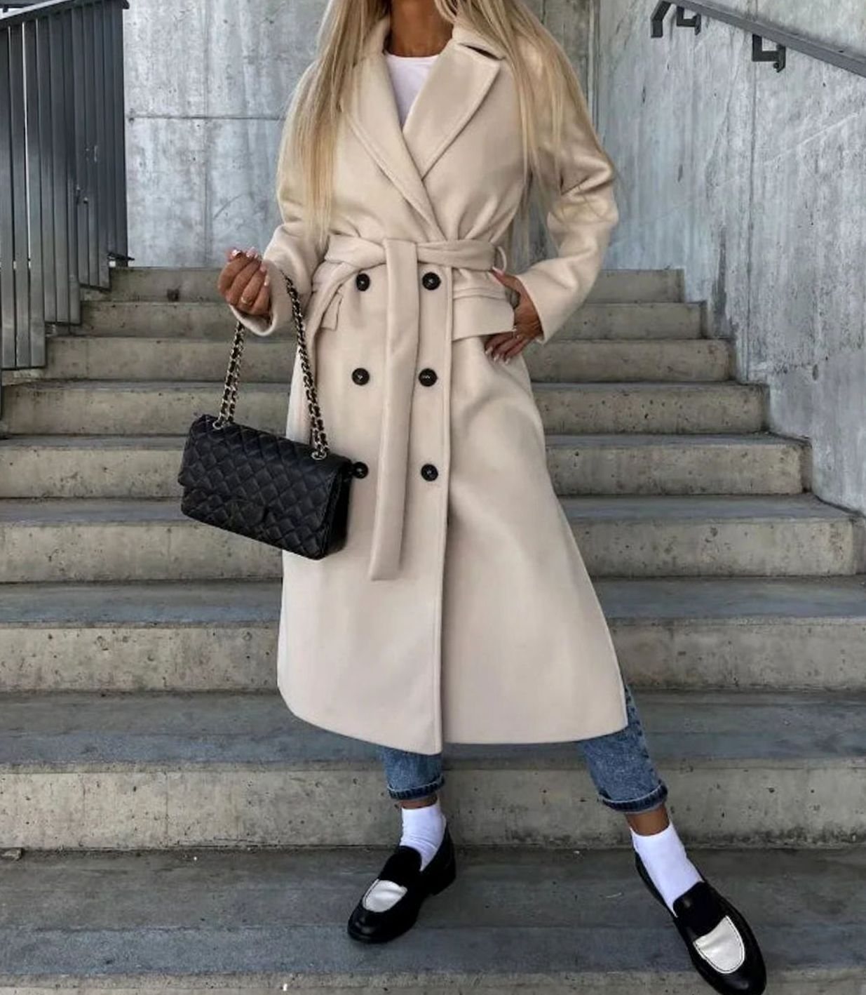 Long wool coat for women featuring a double-breasted design in classic black, tailored fit for a stylish and sophisticated look. 2