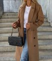 Long wool coat for women featuring a double-breasted design in classic black, tailored fit for a stylish and sophisticated look. 5