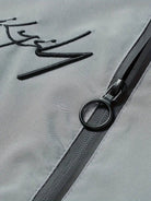 Men's black polyester bomber jacket featuring a zip-up front, baseball collar, and stylish embroidered detail. 1