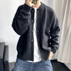 Men's black cardigan featuring a button-up front, patch pockets, and a relaxed fit knit design, perfect for casual wear and layering. 3