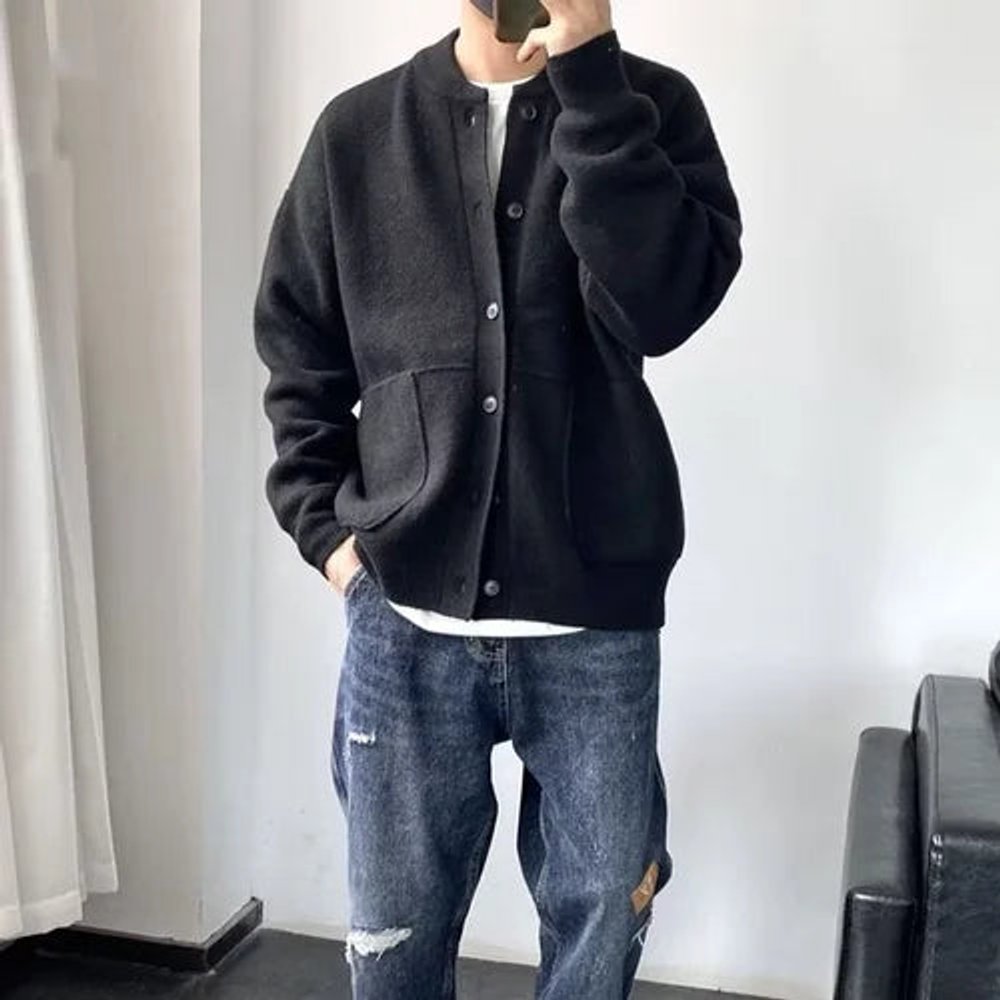 Men's black cardigan featuring a button-up front, patch pockets, and a relaxed fit knit design, perfect for casual wear and layering. 4