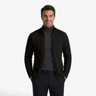Men's black wool cardigan featuring a warm cable knit design and button closure, perfect for autumn and winter layering. 9
