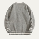 Men's cardigan with button front and V-neck design, featuring a soft knit texture, available in grey, cream, charcoal, and rust brown for a 4