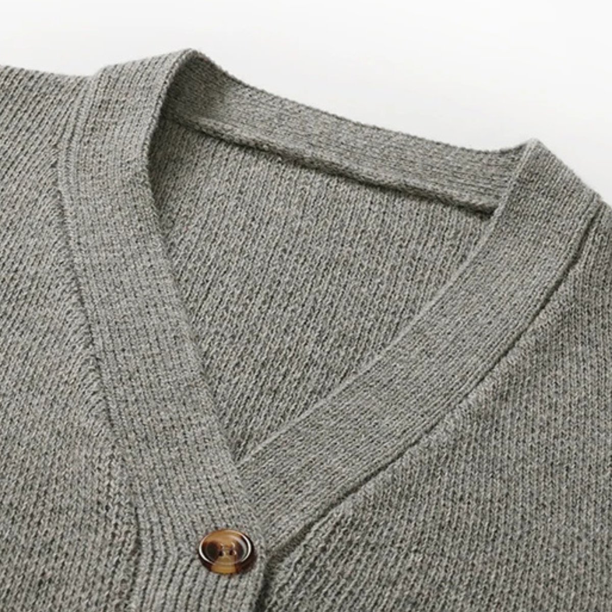 Men's cardigan with button front and V-neck design, featuring a soft knit texture, available in grey, cream, charcoal, and rust brown for a 5
